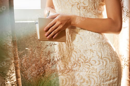 Preview: Woman opening diary
