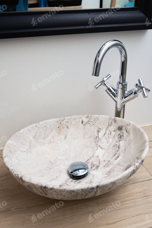 Preview: Bathroom interior with marble sink and faucet