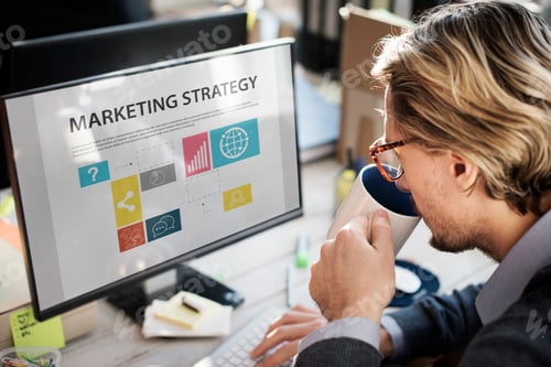 Preview: Closeup of caucasian man drinking coffee with computer screen showing marketing strategy