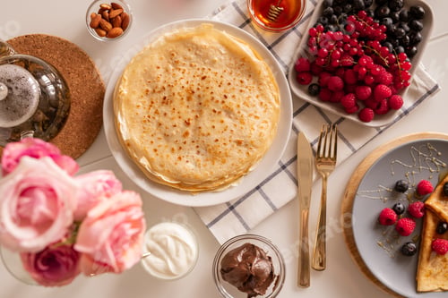 Preview: Flat layout of kitchen table served for breakfast with appetizing homemade food