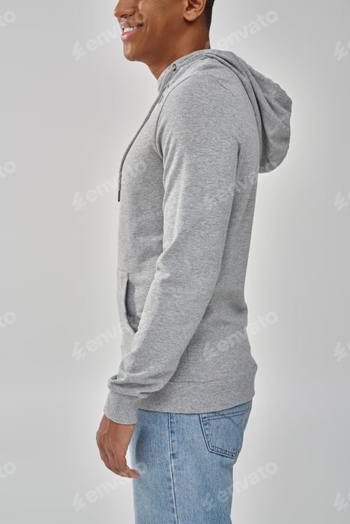 Preview: stylish african american man in gray casual sweatshirt and jeans, copy space for advertising