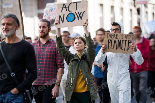 Preview: People with placards and protective suit on global strike for climate change.