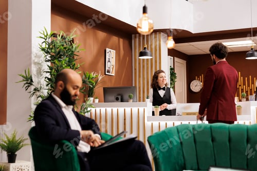 Preview: Hotel staff greeting businessman
