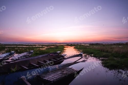 Preview: Wooden Boats on Calm Waters at Sunset