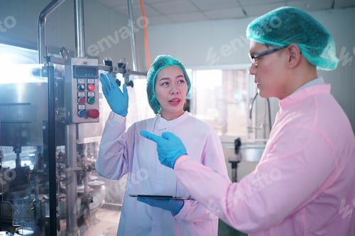 Preview: Industry Worker entering data in machine at factory