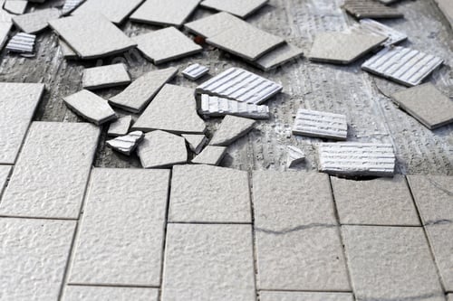 Preview: Cracked brown tiles on cement floor