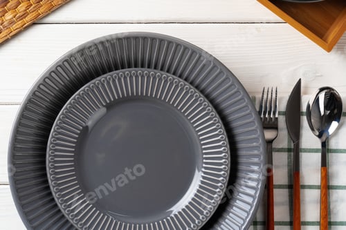 Preview: Glossy grey ceramic plate with cutlery on wooden table