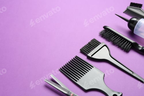 Preview: Different hairdresser's tools on violet background, closeup. Space for text