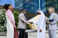 Preview: Group of multiethnic business people meeting an emirati businessman