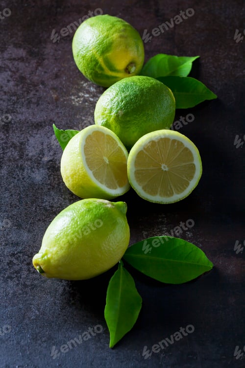 Preview: Green organic lemons on dark background