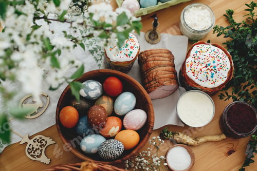 Preview: Easter modern eggs, easter bread, ham, beets, butter, green branches and flowers