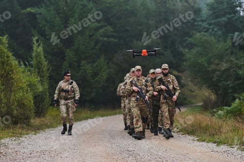 Preview: An elite military unit, led by a major, confidently parades through dense forest, showcasing