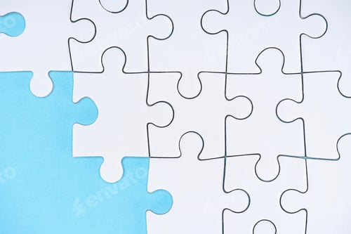 Preview: flat lay with white puzzle pieces on blue background