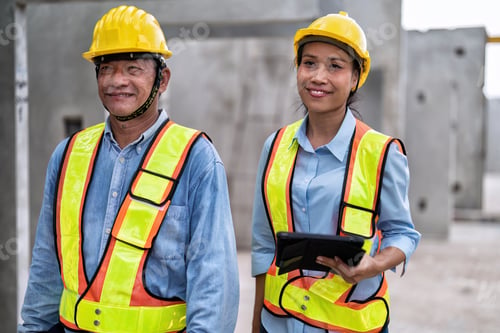 Preview: At building construction site senior engineer and supervisor check quality precast concrete slabs