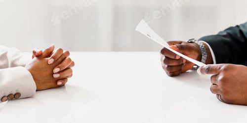 Preview: Unrecognizable African American HR manager with resume and female job appicant on employment