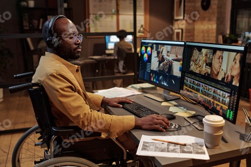 Preview: Professional video editor working at office