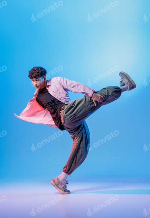Preview: Bboy high kick in neon studio with copy space for youth music promos
