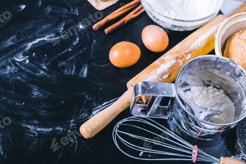 Preview: Ingredients and utensil for baking on the black board, top view