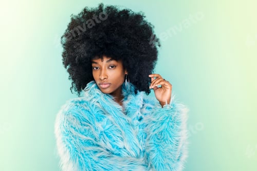 Preview: Cute young Black woman wearing a cool blue winter top