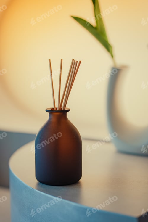 Preview: aromatherapy and home perfume concept - aroma reed diffuser on wooden shelf