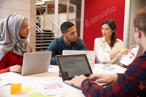 Preview: Group Of Students Meeting For Tutorial With Teacher