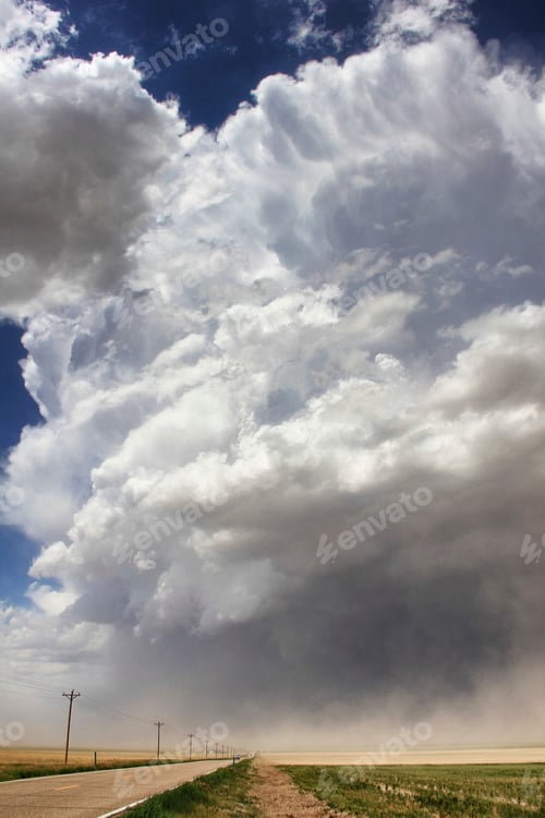 Preview: Majestic thunderclouds loom over a rural road