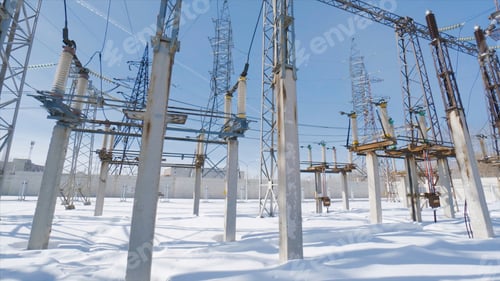 Preview: Poles and cables of power plant in winter. Action. Power plant in field on sunny winter day