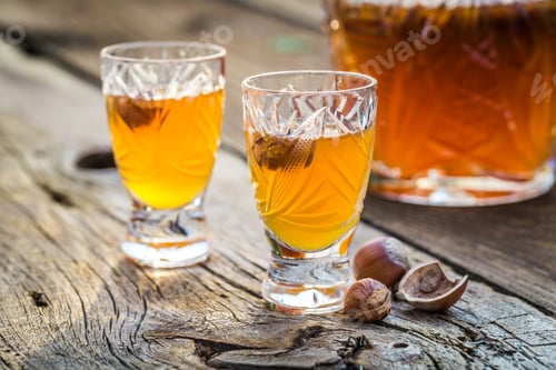 Preview: Sweet liqueur with nuts and alcohol on old wooden table