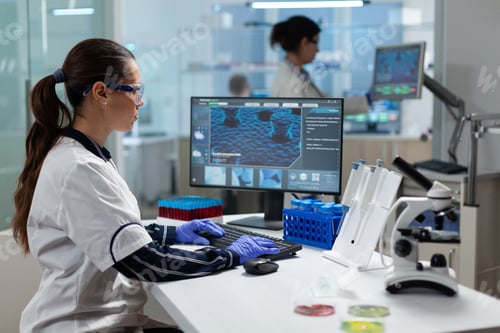 Preview: Scientist researcher chemist woman typing microbiology test expertise