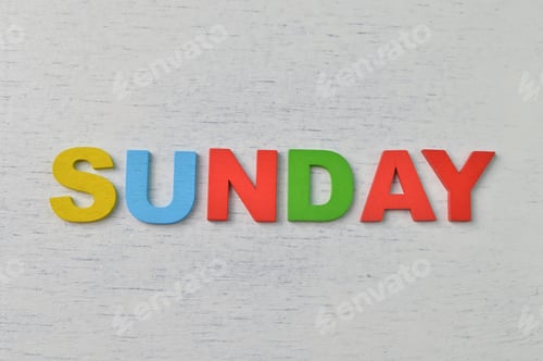 Preview: Colorful wooden alphabet with text SUNDAY. A happy Sunday concept