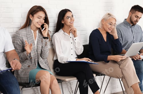 Preview: People waiting for job interview in office