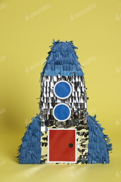 Preview: One rocket shaped pinata on yellow background