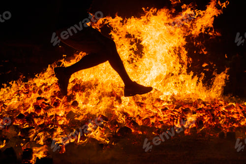 Preview: Summer solstice celebration jumping into the fire. Burning flames