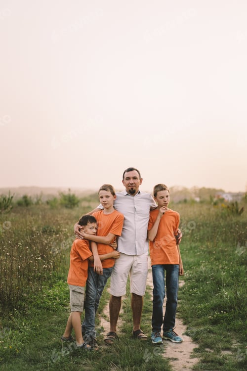 Preview: Happy Fathers day. Father with son are walking in the field.