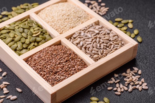 Preview: Sunflower, pumpkin, flax and sesame seeds in a wooden box