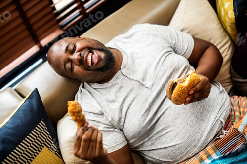 Preview: Man eating a big hamburger