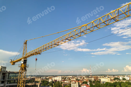 Preview: Apartment or office tall building under construction. Brick walls, glass windows, scaffolding and