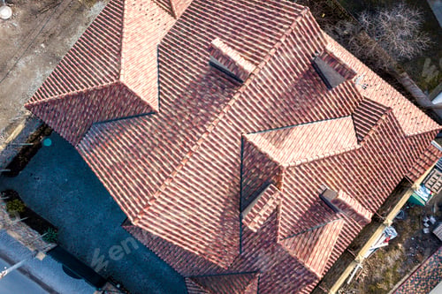 Preview: Top aerial view of building complex shingle roof construction. Abstract background.