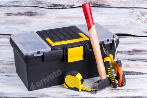 Preview: Tool box and different tools on wooden background