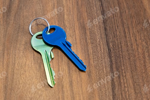 Preview: keys on wooden table background. rent sell buy apartment estate business