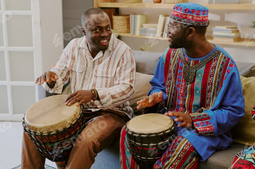 Preview: Middle Aged Black Men Celebrating Kwanzaa by Playing Traditional Drums