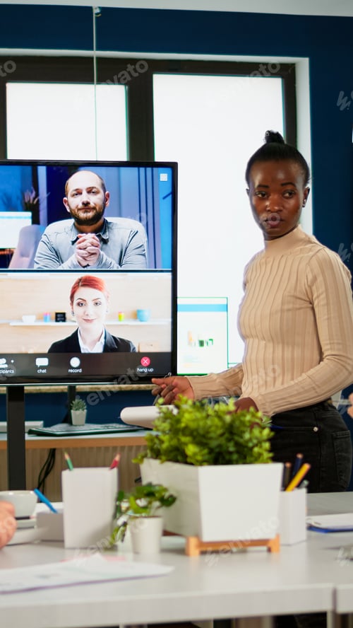 Preview: Black manager woman talking with remotely colleagues on video call