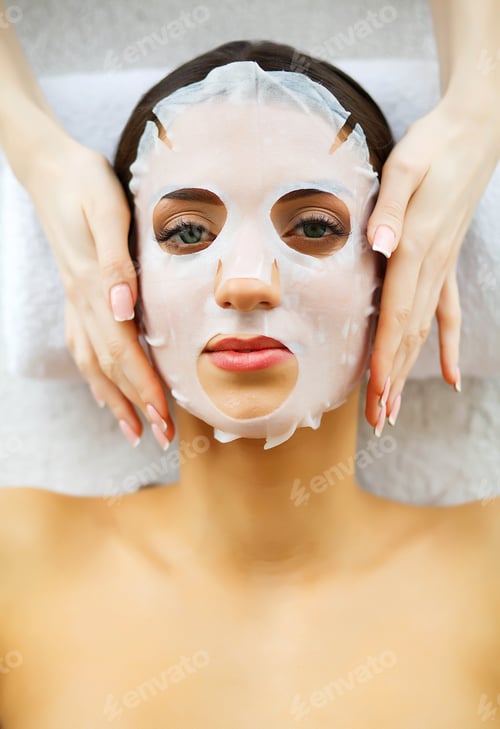 Preview: Beautiful Woman in the Beauty Salon with Face Mask. Lying on the Massage Tables.