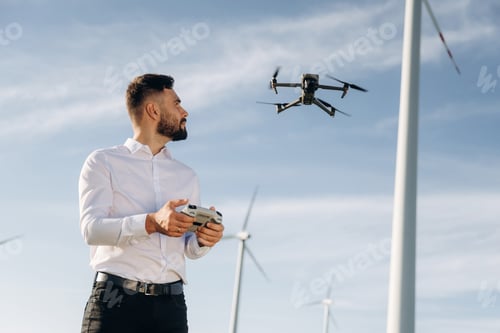 Preview: Controlling the drone. Engineer in field checking on wind turbine production