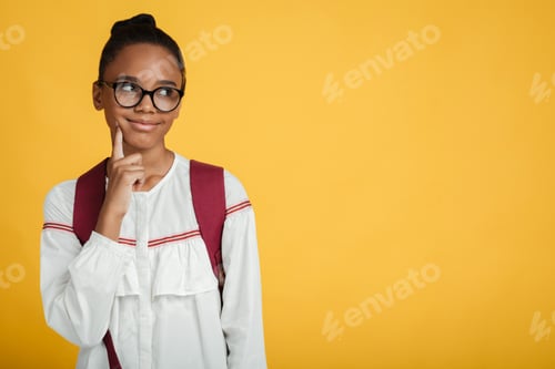 Preview: Pensive smart teen afro american female pupil in glasses with backpack thinks and looks at empty