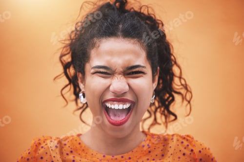 Preview: Closeup beautiful mixed race fashion woman smiling and laughing against an orange wall background i