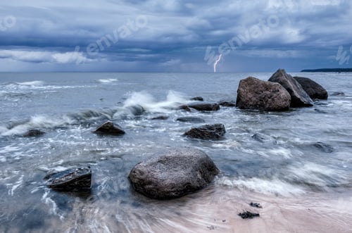 Preview: Seascape. Storm clouds gathering over the rocky beach.