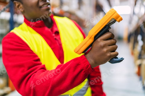 Preview: Warehouse worker scanning packages with barcode scanner