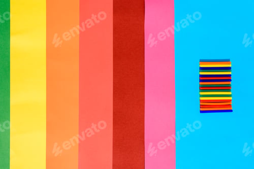 Preview: Colorful background of plastic bars, silicone glue, on a background of colored lines.