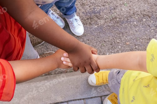 Preview: Multiethnic kids hands together. children diversity
